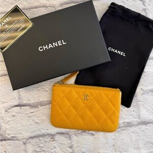 CHANEL Yellow mini o case pouch